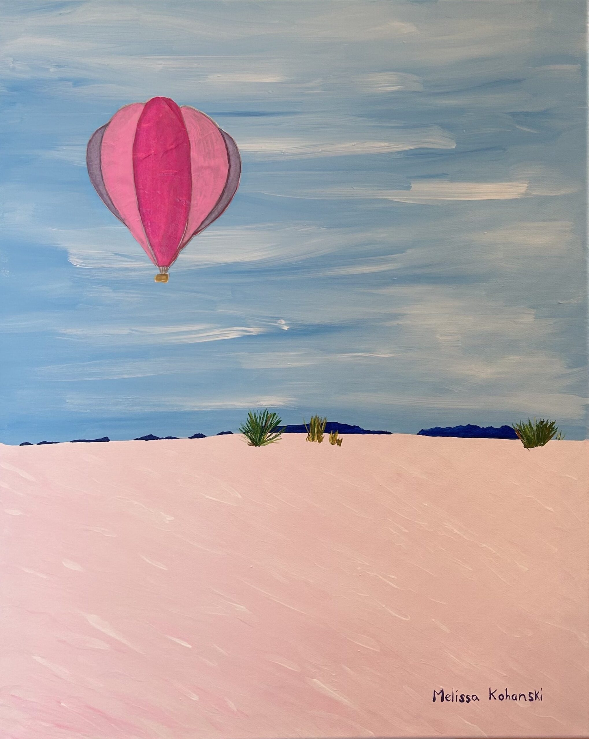 Acrylic paint and tissue paper of hot air balloon over sand